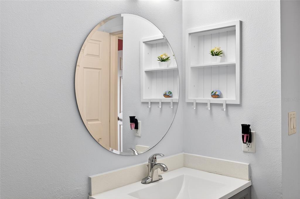 622 Ridge Terrace Winter Haven, FL 33881 - Photo 16 of 34 a bathroom with a sink and a mirror