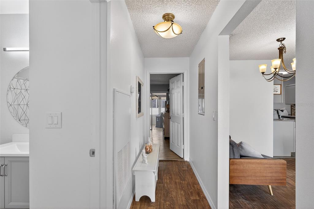 622 Ridge Terrace Winter Haven, FL 33881 - Photo 17 of 34 a view of a hallway with a chandelier
