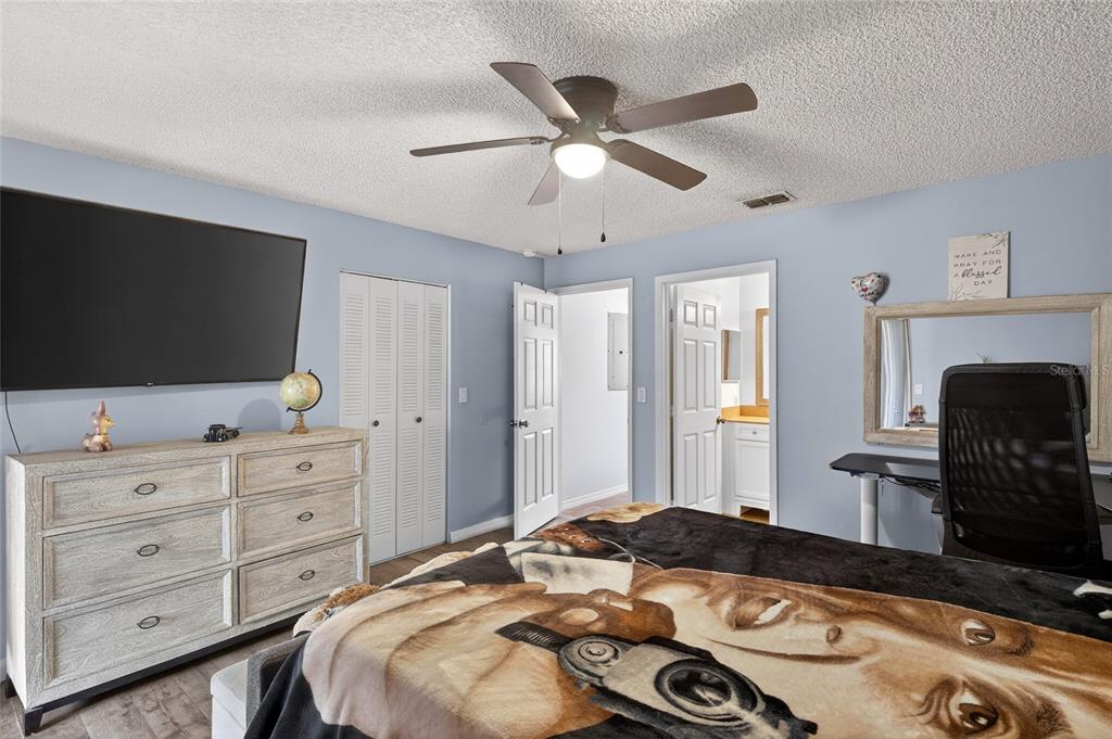622 Ridge Terrace Winter Haven, FL 33881 - Photo 20 of 34 a bedroom with a bed and a flat screen tv
