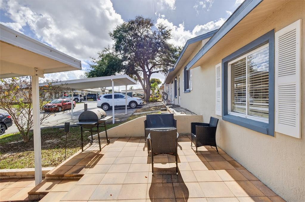 622 Ridge Terrace Winter Haven, FL 33881 - Photo 26 of 34 a outdoor space with lots of chairs and a table