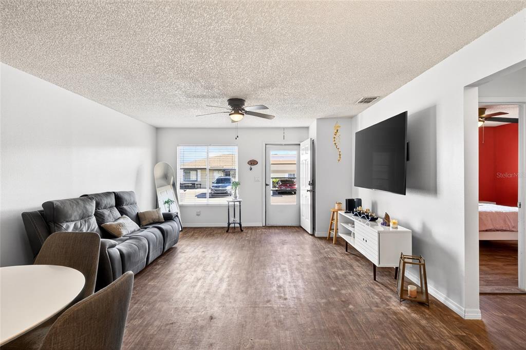 622 Ridge Terrace Winter Haven, FL 33881 - Photo 4 of 34 a living room with furniture and a flat screen tv