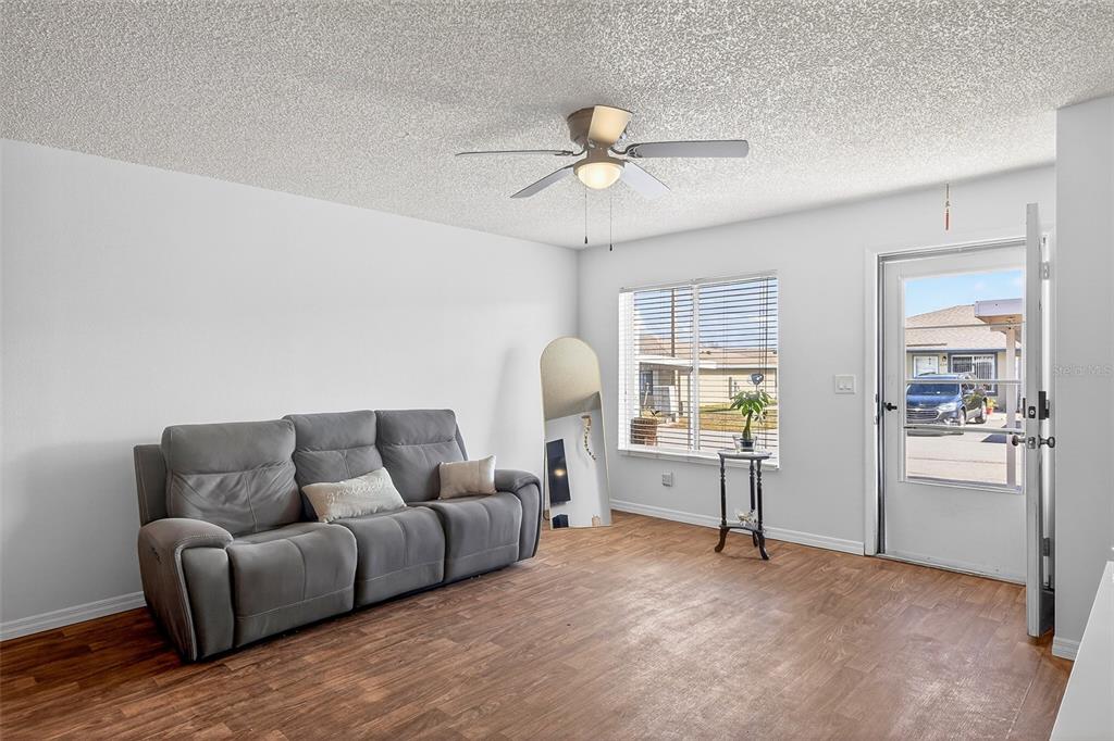 622 Ridge Terrace Winter Haven, FL 33881 - Photo 5 of 34 a living room with furniture and a window