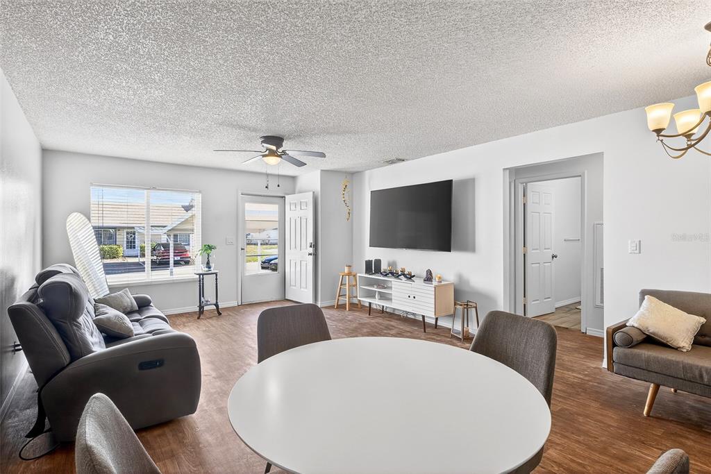 622 Ridge Terrace Winter Haven, FL 33881 - Photo 7 of 34 a living room with furniture and a flat screen tv
