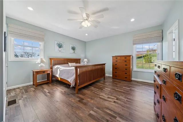 a bedroom with furniture and a chandelier