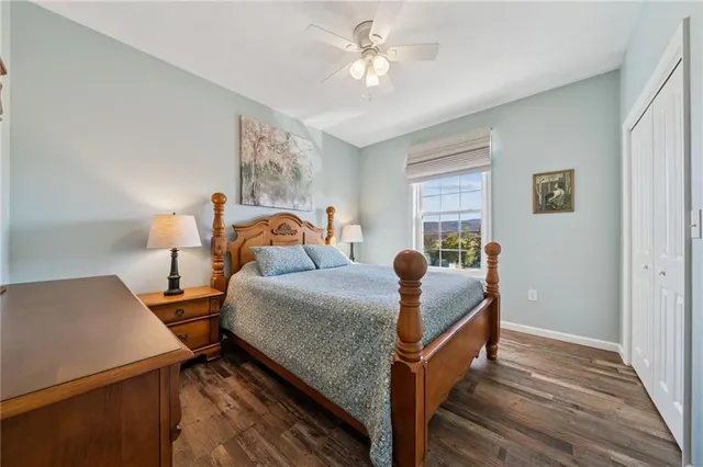 a bedroom with bed and window