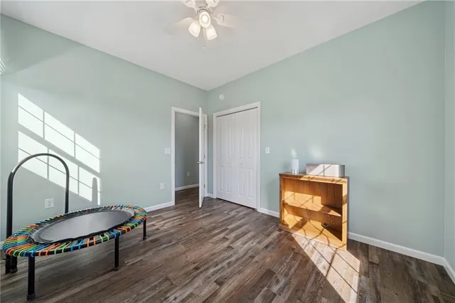 a bedroom with bed and a window