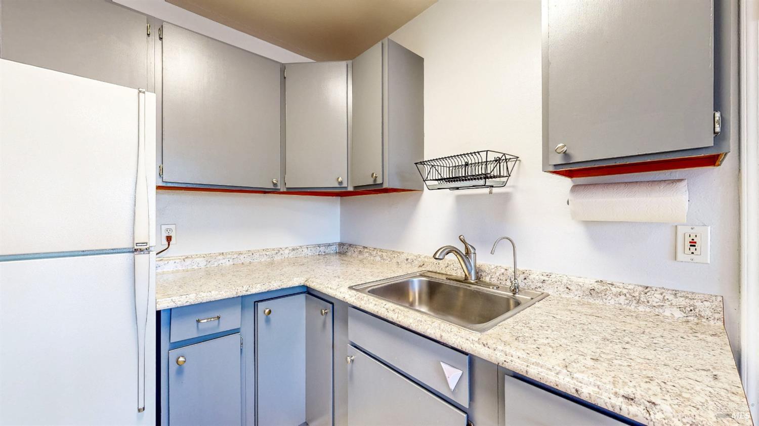 809 Maple Avenue Vallejo, CA 94591 - Photo 16 of 46 a kitchen with a sink and cabinets