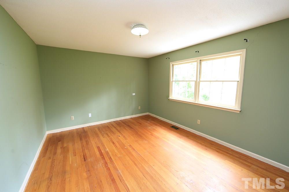 1933 Fountain Ridge Road Chapel Hill, NC 27517 - Photo 9 of 22 Enjoy a spacious master bedroom with attached en suite. All of the bedrooms have hardwood floors!