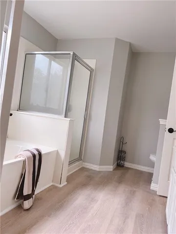 a view of a hallway with furniture and closet