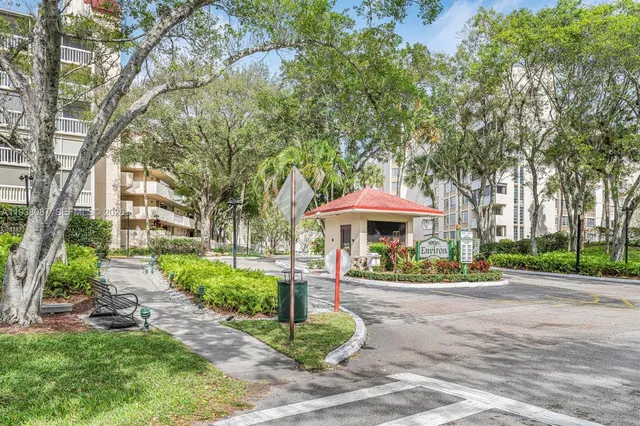 a view of residential houses with outdoor space and lake view