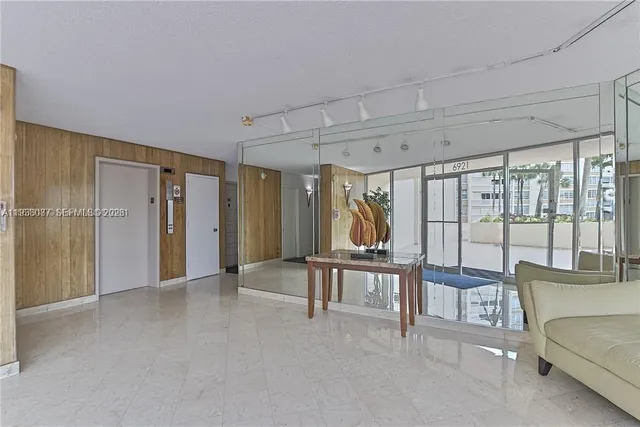 a view of a park with bench and trees