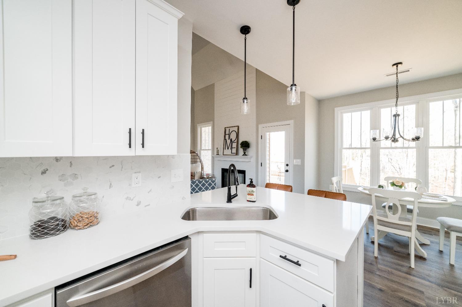 506 Bridge Tree Court Evington, VA 24550 - Photo 16 of 60 a kitchen with a sink cabinets and window