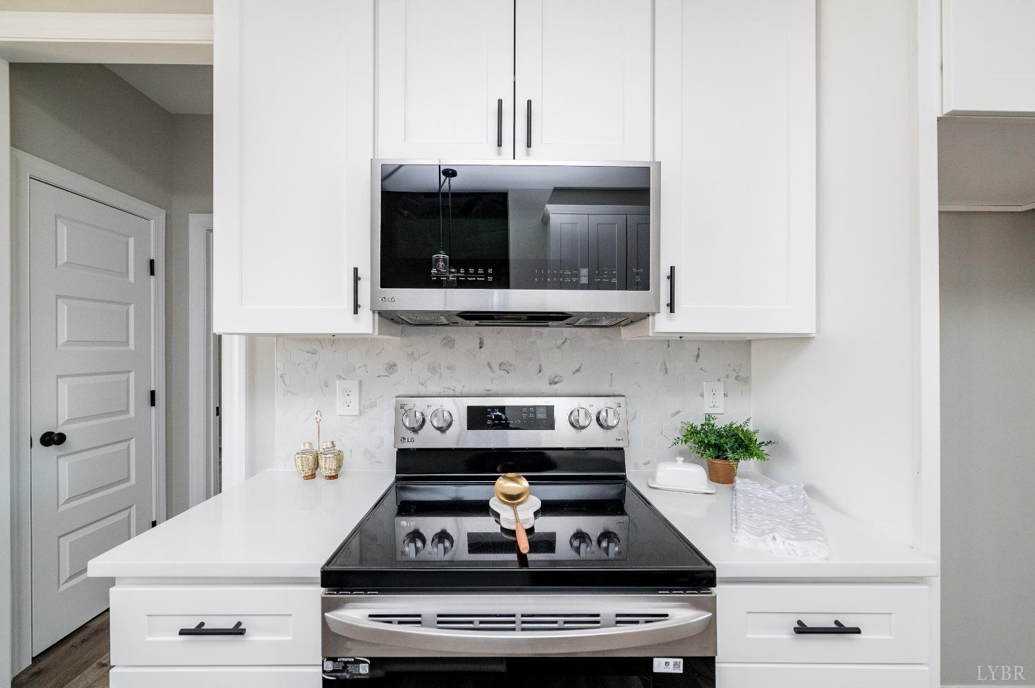 506 Bridge Tree Court Evington, VA 24550 - Photo 17 of 60 a stove top oven sitting inside of a kitchen