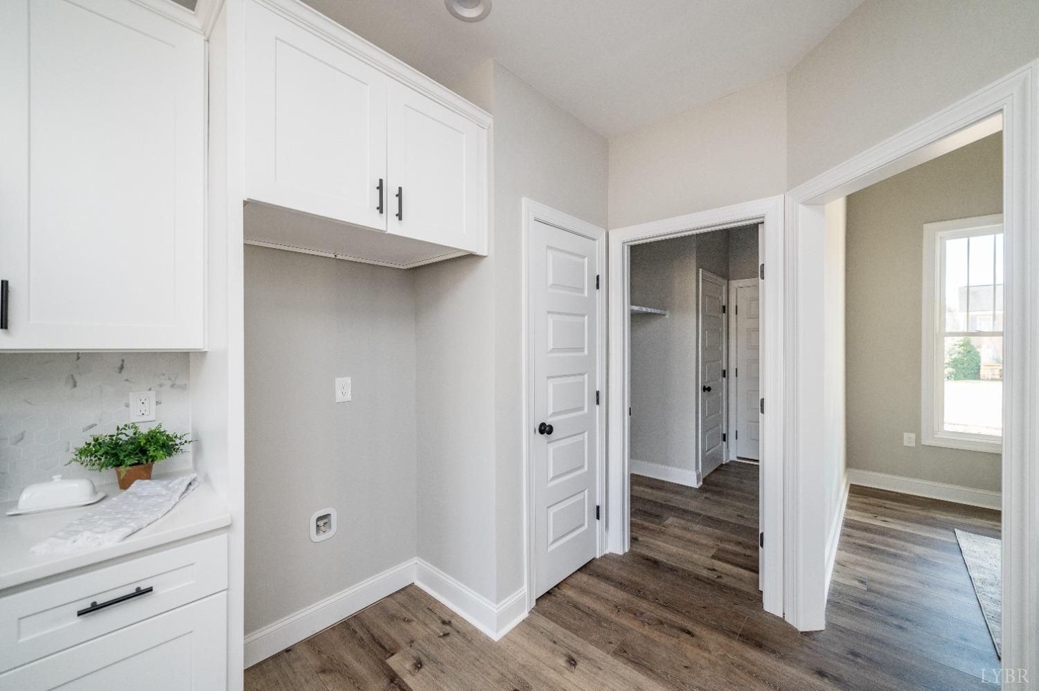 506 Bridge Tree Court Evington, VA 24550 - Photo 19 of 60 a view of a hallway with wooden floor and staircase