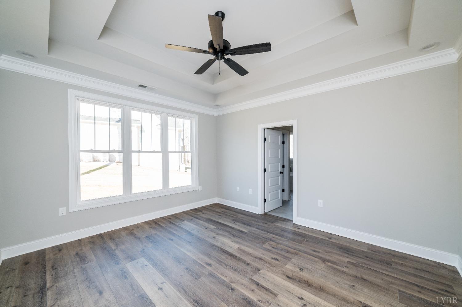 506 Bridge Tree Court Evington, VA 24550 - Photo 22 of 60 wooden floor in an empty room with a window