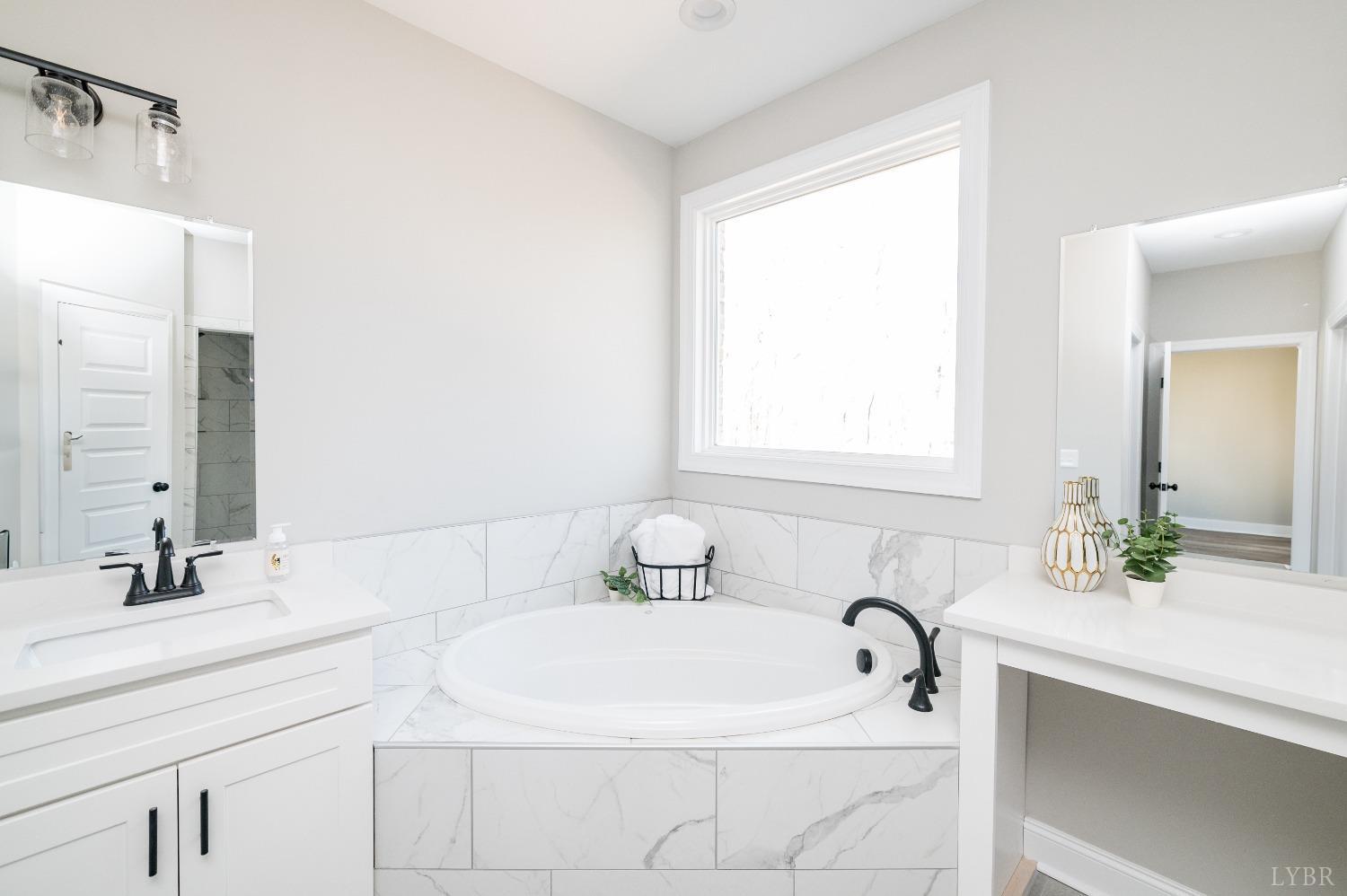 506 Bridge Tree Court Evington, VA 24550 - Photo 26 of 60 a bathroom with a sink and a mirror