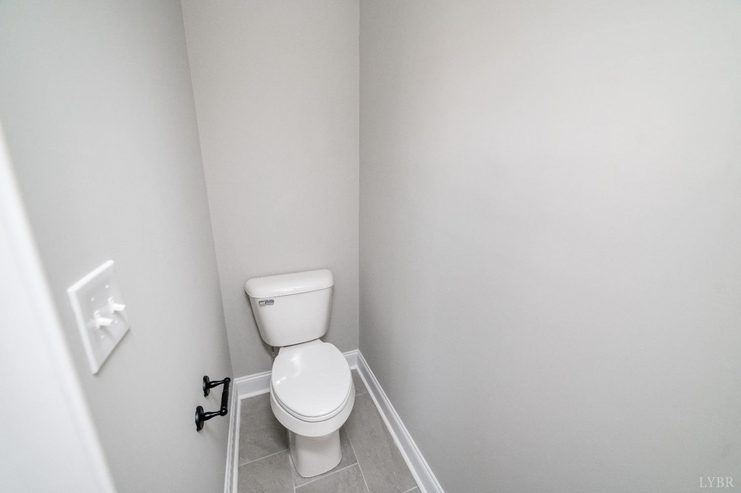 506 Bridge Tree Court Evington, VA 24550 - Photo 31 of 60 a white toilet sitting next to a white wall