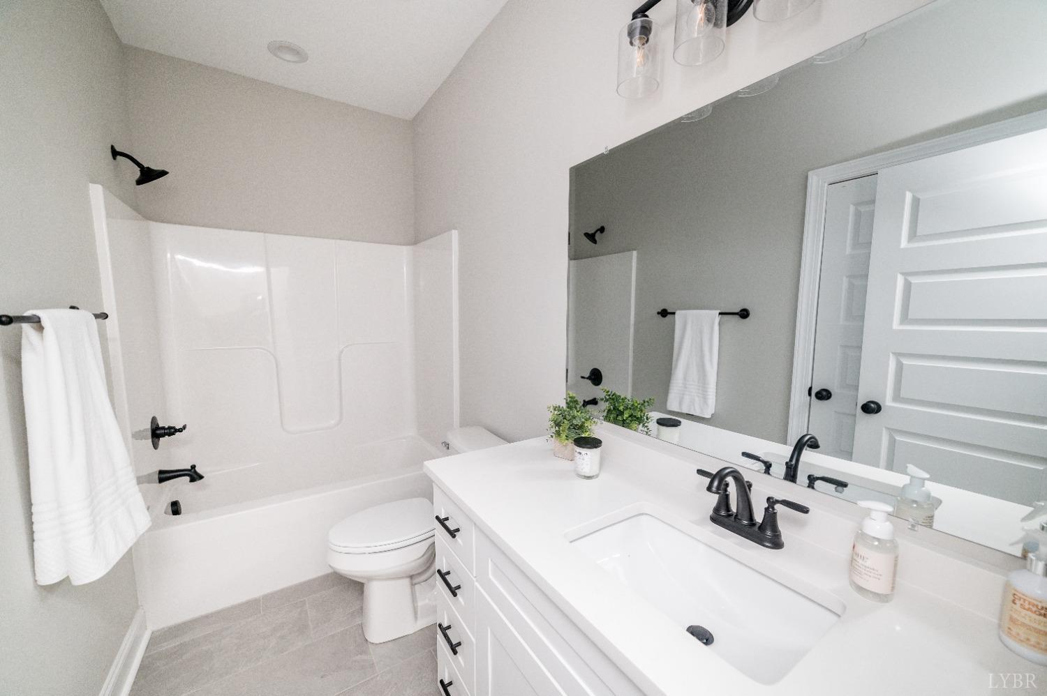 506 Bridge Tree Court Evington, VA 24550 - Photo 35 of 60 a bathroom with a sink toilet tub and shower