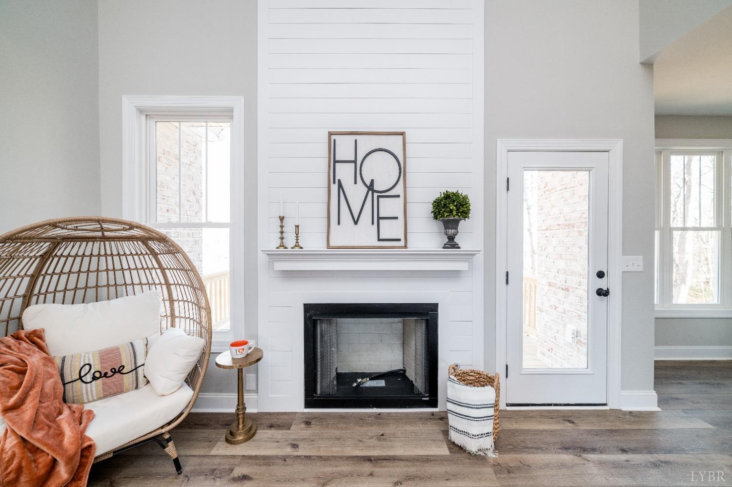 506 Bridge Tree Court Evington, VA 24550 - Photo 4 of 60 a living room with a fireplace with wooden floor