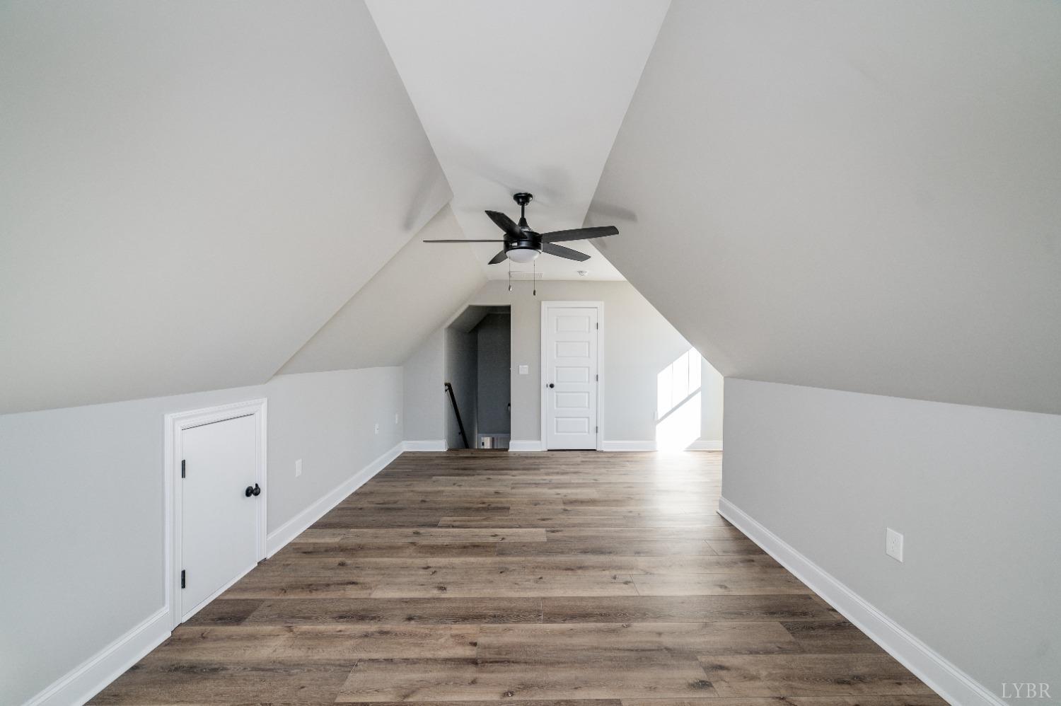 506 Bridge Tree Court Evington, VA 24550 - Photo 41 of 60 a view of a hallway with wooden floor and staircase