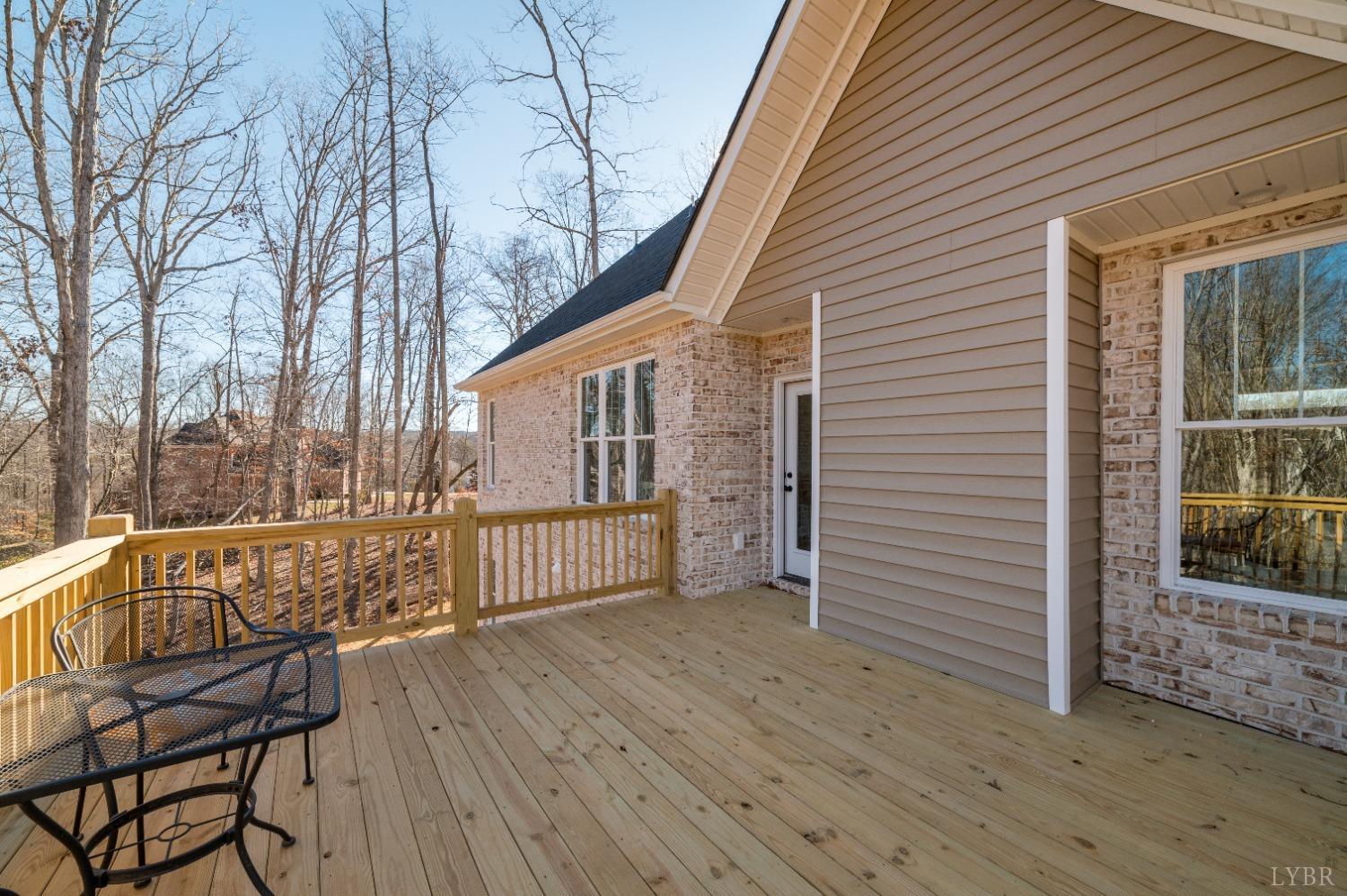 506 Bridge Tree Court Evington, VA 24550 - Photo 43 of 60 a view of a chair and table on the wooden floor