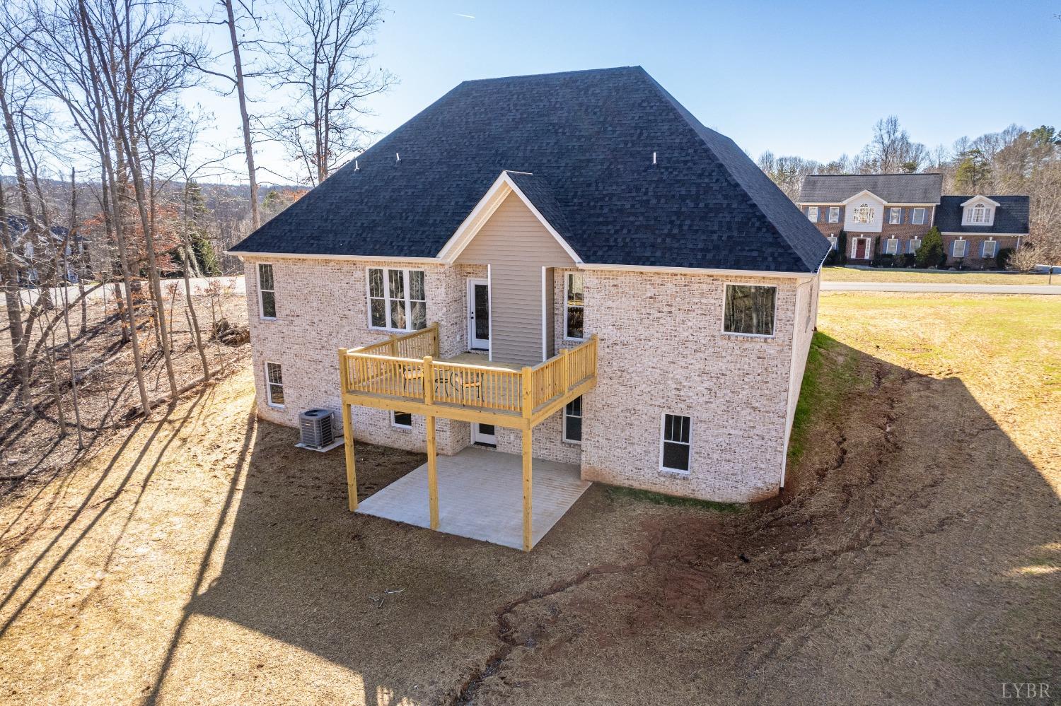 506 Bridge Tree Court Evington, VA 24550 - Photo 48 of 60 a view of a house with backyard and sitting area