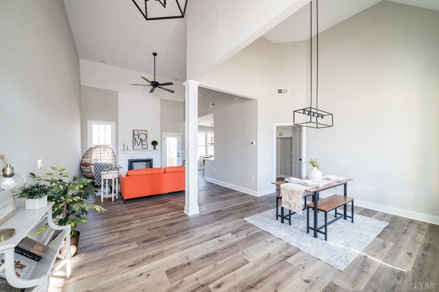 506 Bridge Tree Court Evington, VA 24550 - Photo 5 of 60 a dining room with wooden floor table and chairs