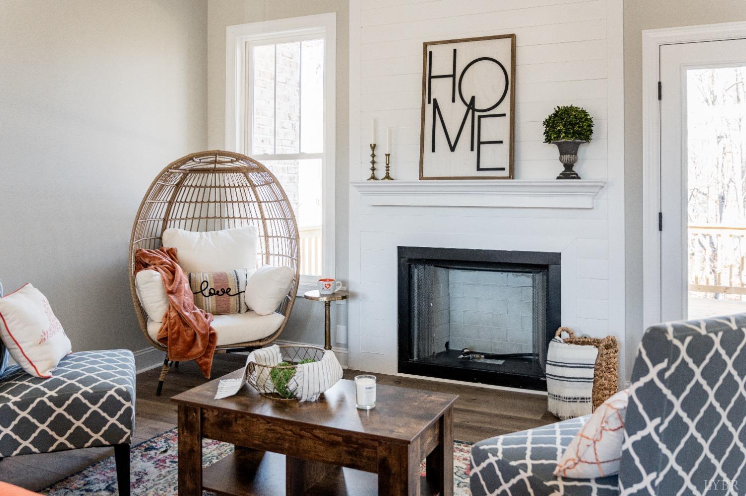 506 Bridge Tree Court Evington, VA 24550 - Photo 6 of 60 a living room with furniture a fireplace and a window