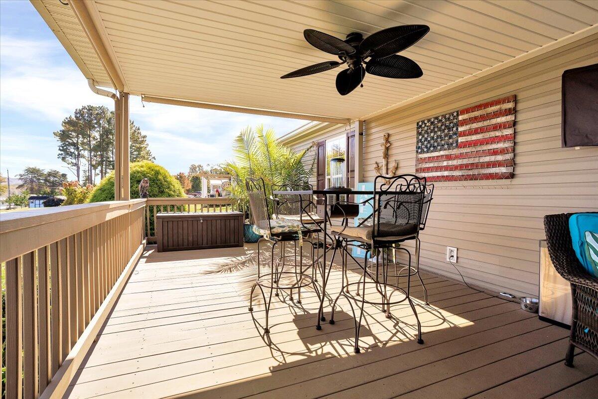 485 Big Cove Drive Penhook, VA 24137 - Photo 11 of 60 a view of a roof deck with table and chairs