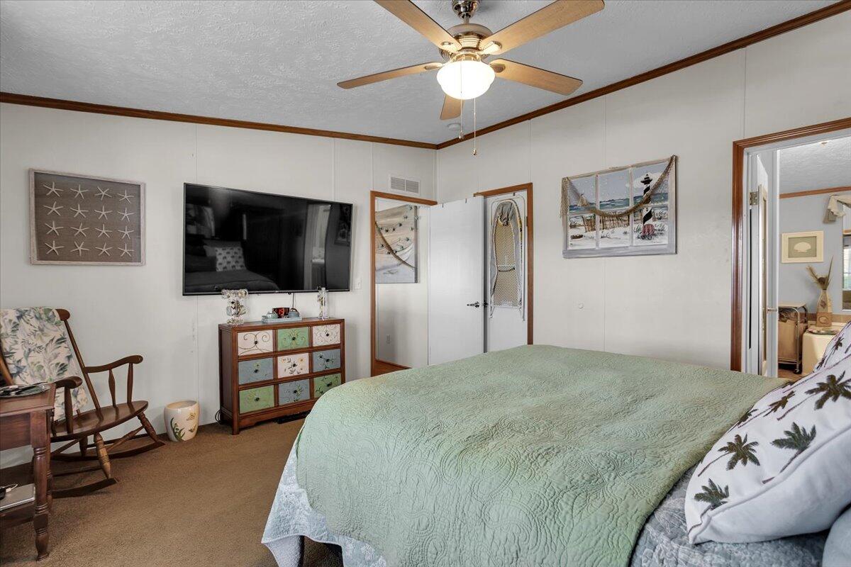 485 Big Cove Drive Penhook, VA 24137 - Photo 16 of 60 a bedroom with a bed and a flat screen tv