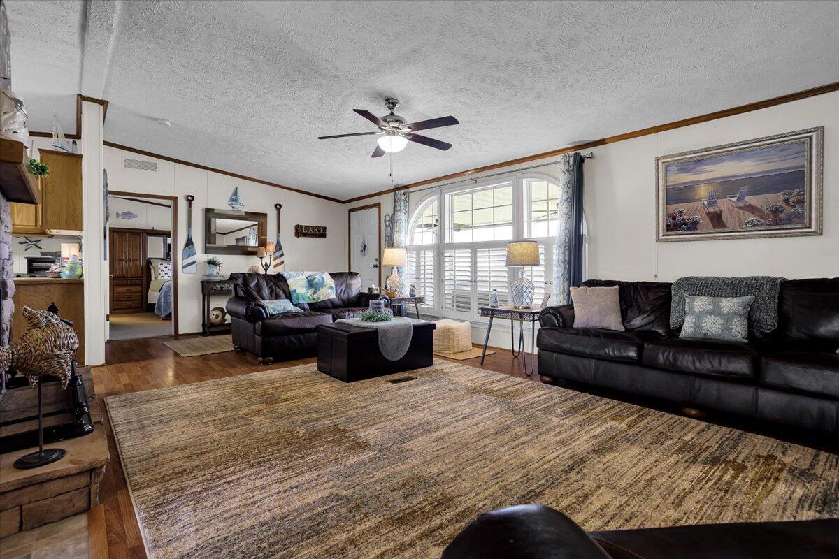 485 Big Cove Drive Penhook, VA 24137 - Photo 22 of 60 a living room with furniture and a large window