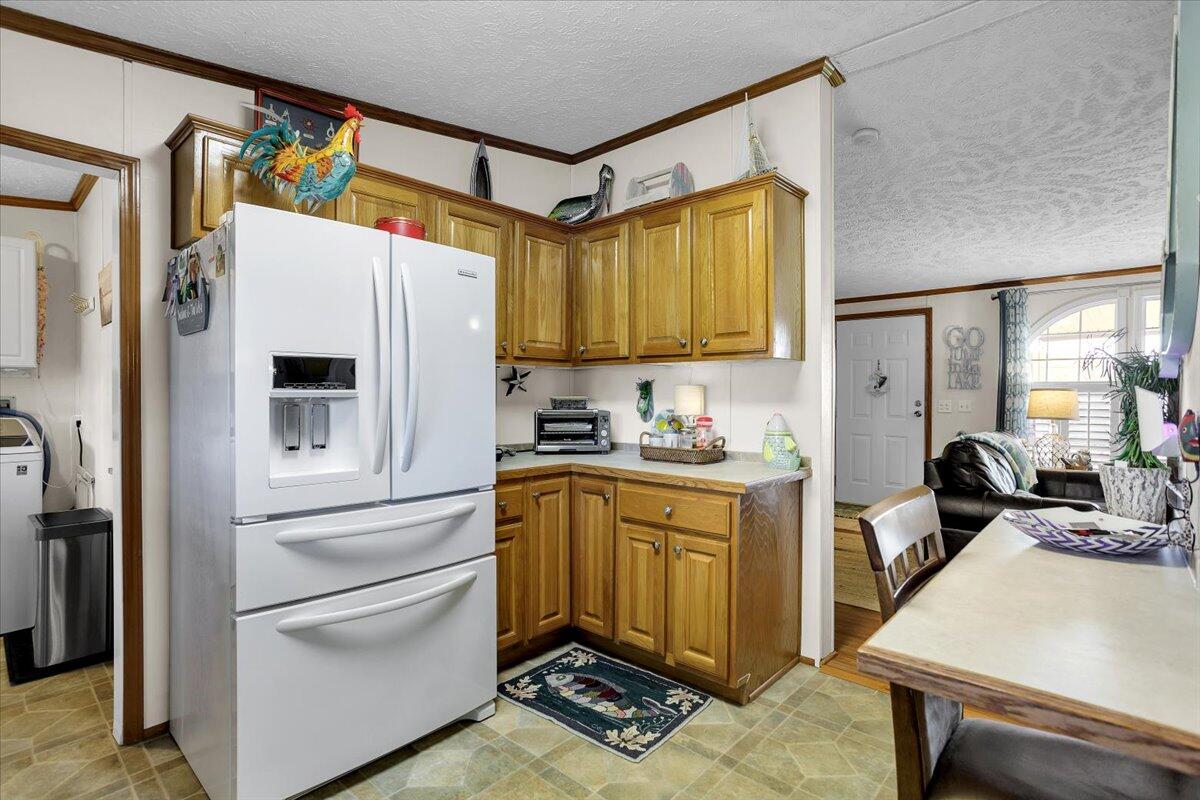 485 Big Cove Drive Penhook, VA 24137 - Photo 26 of 60 a kitchen with stainless steel appliances a refrigerator and a stove