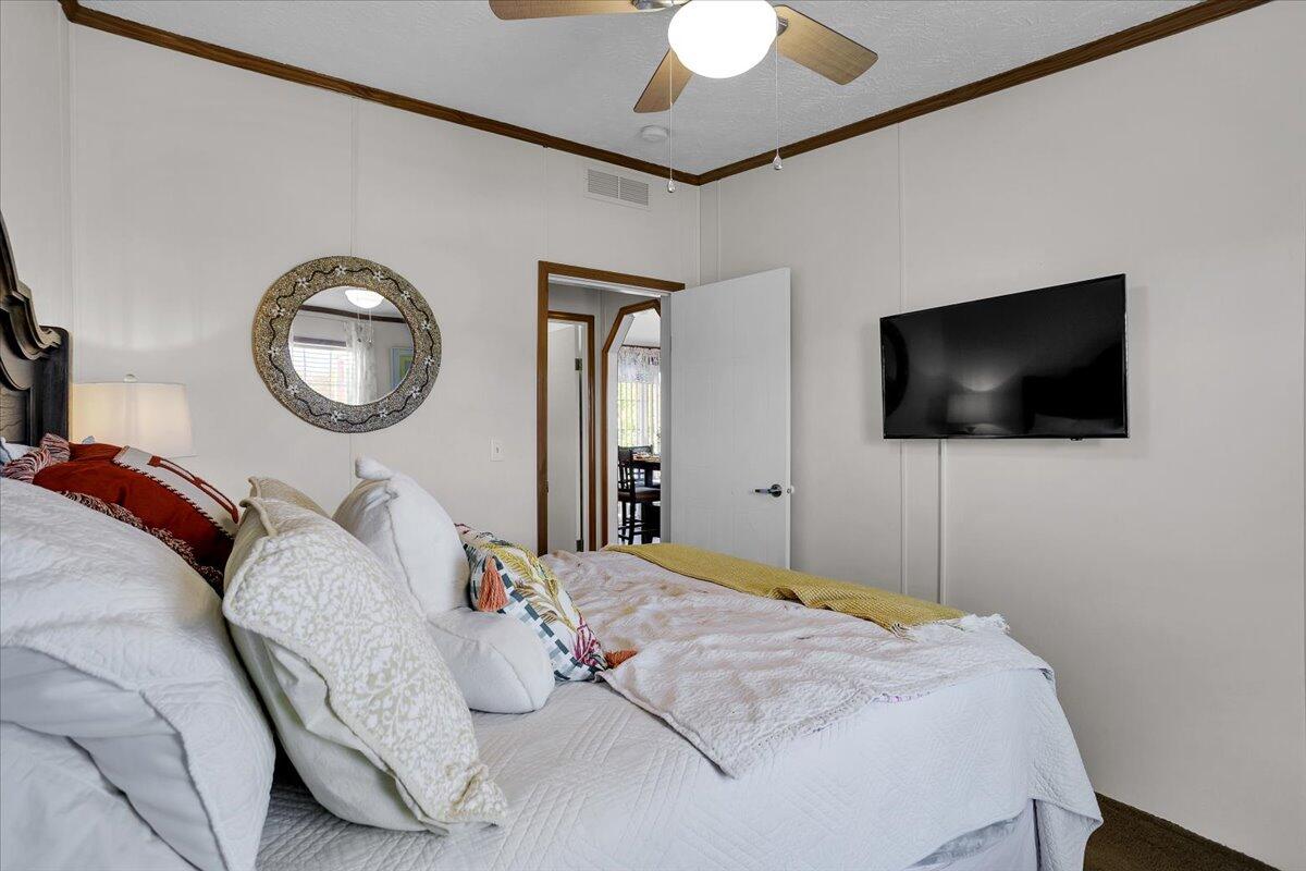 485 Big Cove Drive Penhook, VA 24137 - Photo 32 of 60 a bedroom with a bed and a flat screen tv