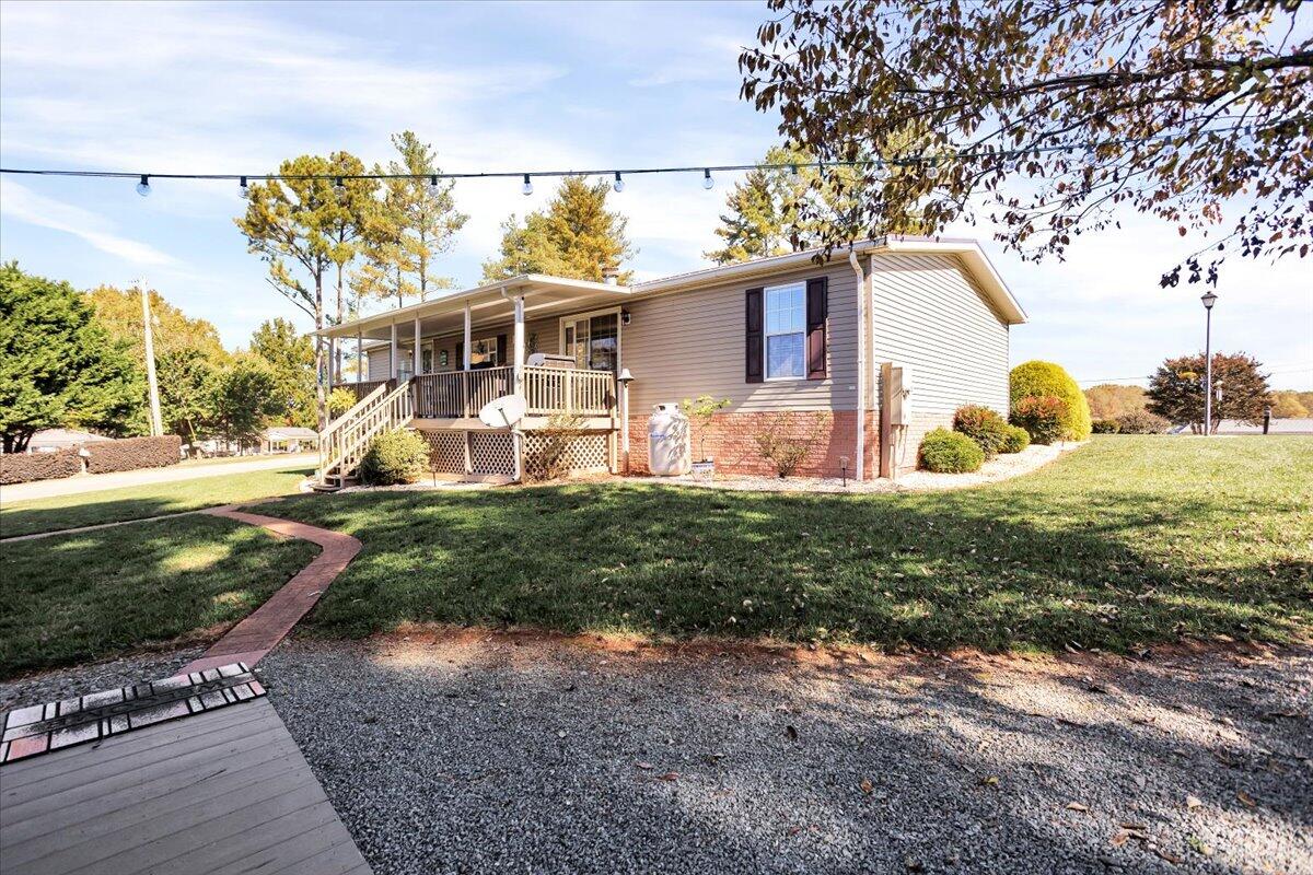 485 Big Cove Drive Penhook, VA 24137 - Photo 9 of 60 a front view of a house with garden