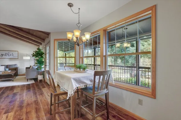 a open kitchen with sink cabinets and wooden floor