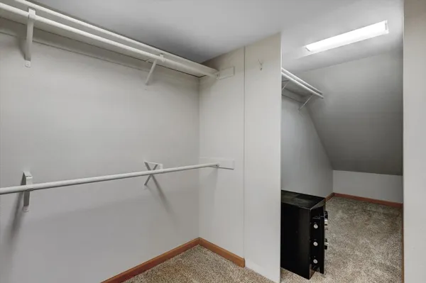 a view of a balcony with wooden floor and fence