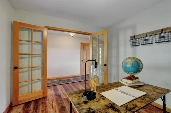 a kitchen with stainless steel appliances granite countertop a stove a refrigerator and a cabinets