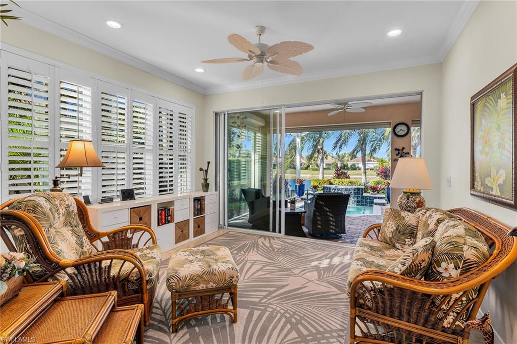 8595 Palermo Court Naples, FL 34114 - Photo 14 of 49 a living room with furniture and a large window