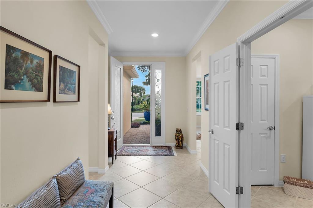8595 Palermo Court Naples, FL 34114 - Photo 25 of 49 a living room with furniture and large windows