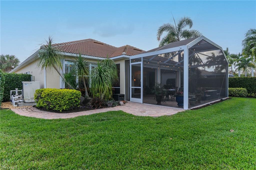 8595 Palermo Court Naples, FL 34114 - Photo 29 of 49 a view of a house with a garden and plants