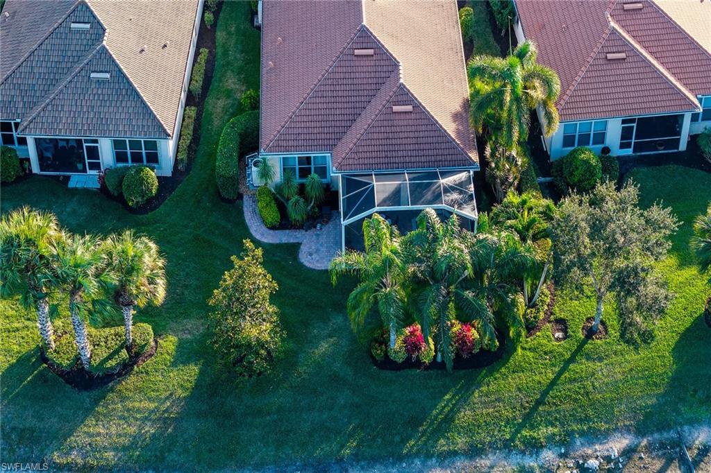 8595 Palermo Court Naples, FL 34114 - Photo 30 of 49 a front view of a house with garden