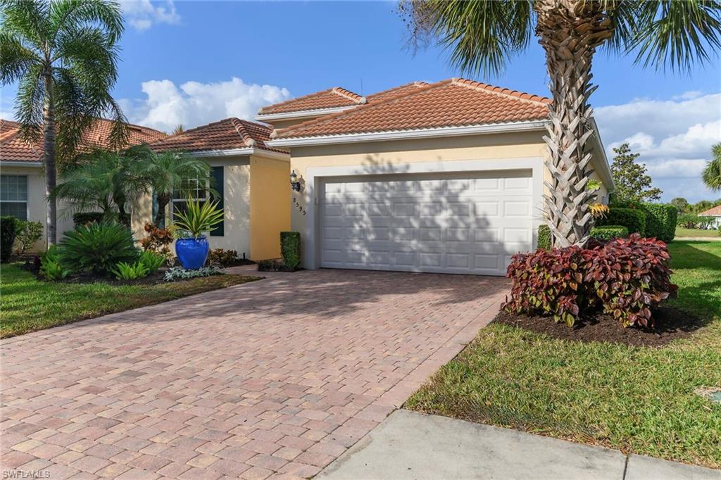 8595 Palermo Court Naples, FL 34114 - Photo 3 of 49 a view of a garden with a patio