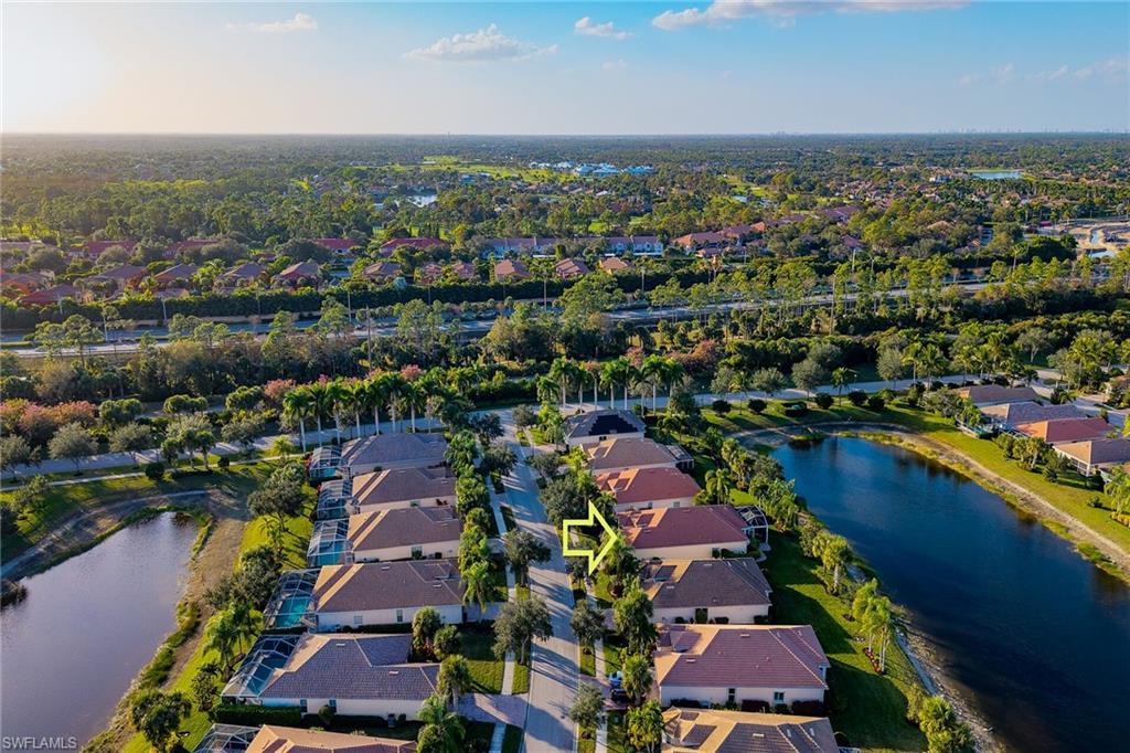 8595 Palermo Court Naples, FL 34114 - Photo 33 of 49 an aerial view of residential houses with outdoor space and river
