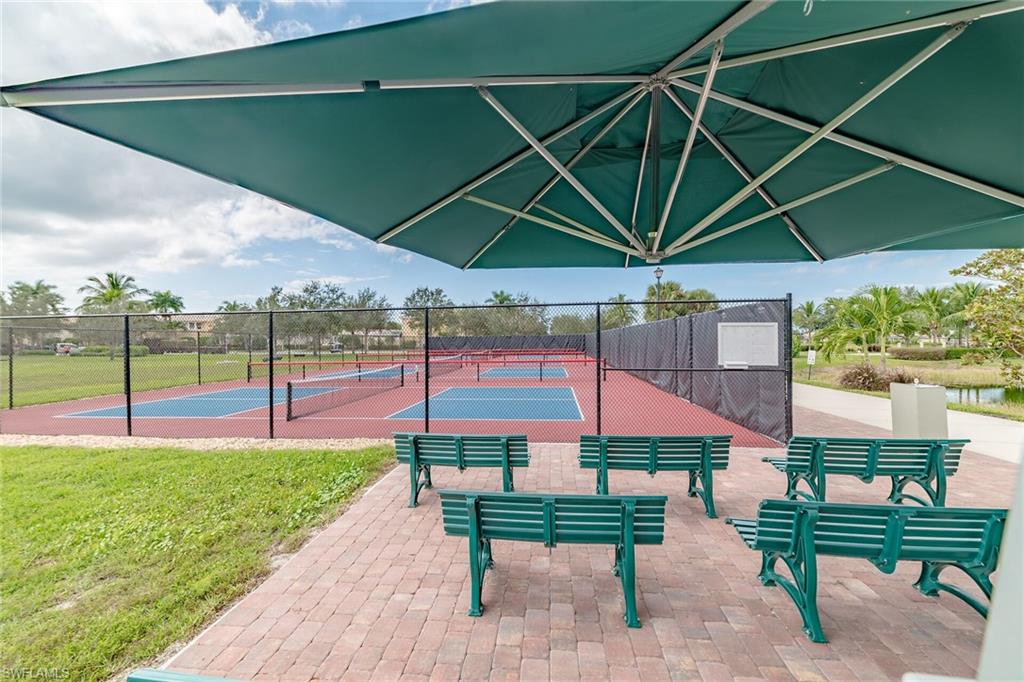 8595 Palermo Court Naples, FL 34114 - Photo 45 of 49 an outdoor space with furniture and umbrella