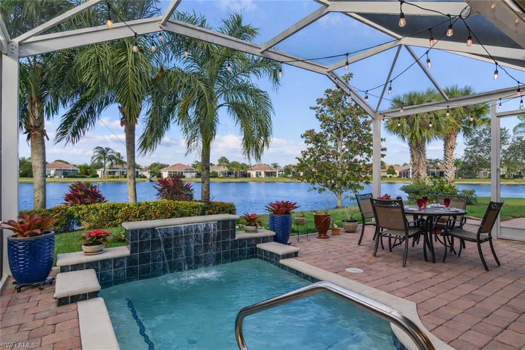8595 Palermo Court Naples, FL 34114 - Photo 9 of 49 a view of a backyard with sitting area