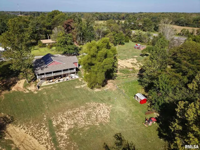 a bed room with a bed mirror and window