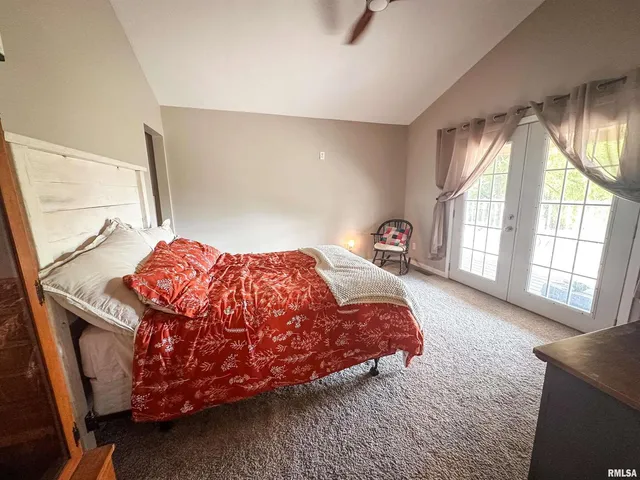 a living room with furniture wooden floor and a window
