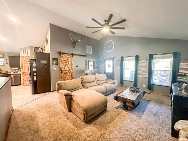 a view of a livingroom with furniture and window