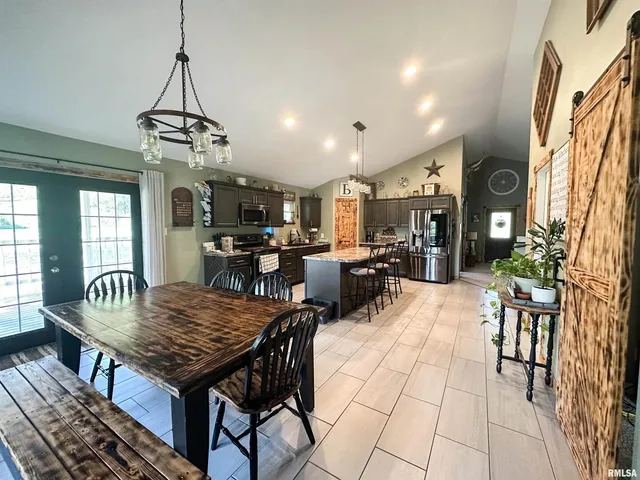 a living room with furniture and a mirror