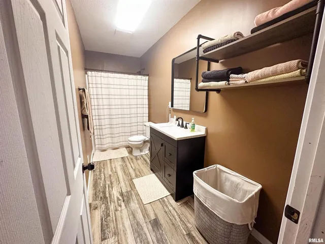 a view of a balcony with floor to ceiling windows wooden floor and outdoor space